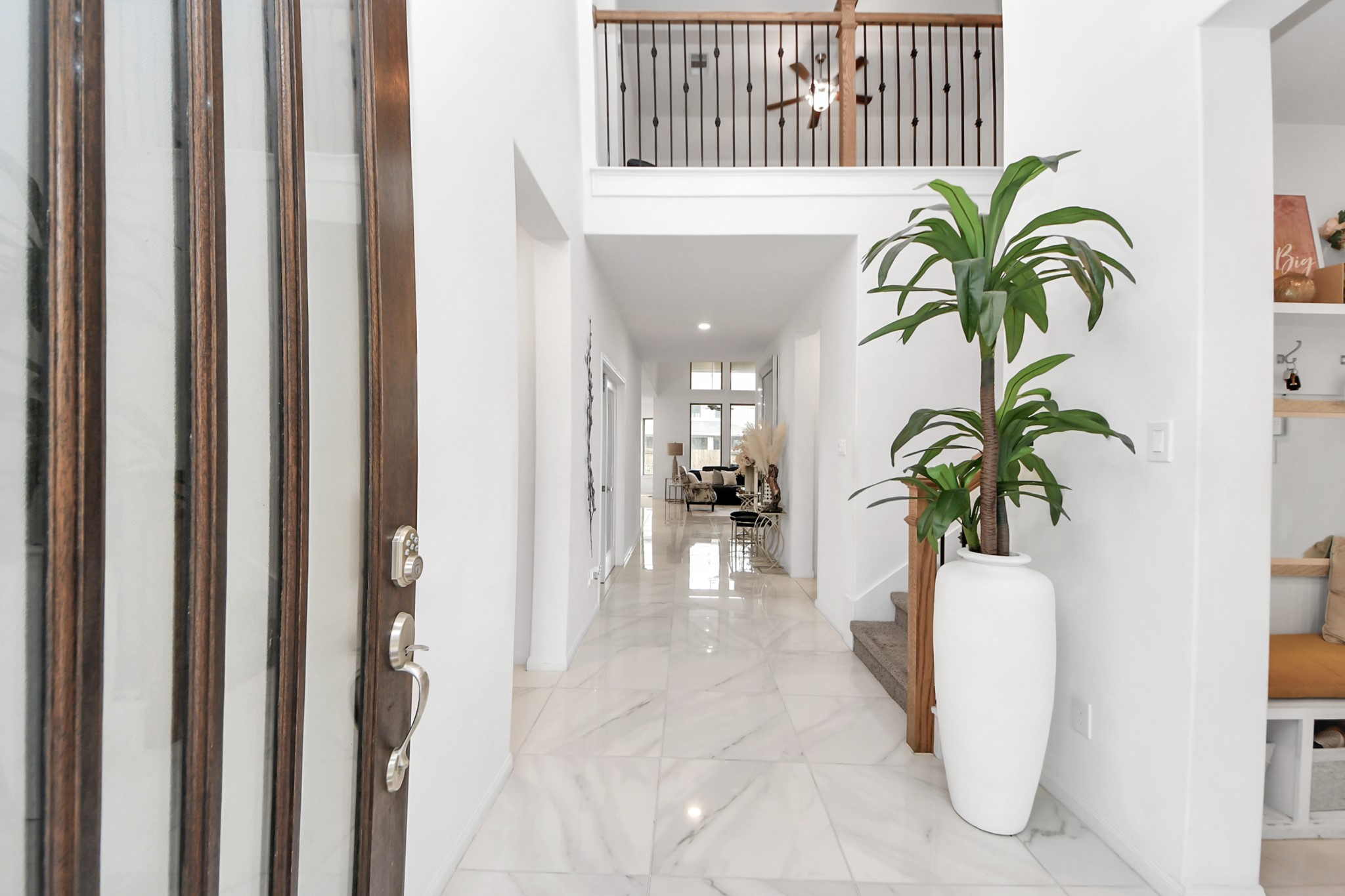 14948 Galileo Gates Drive Conroe, TX 77302 - Photo 2 of 30 a view of a hallway with potted plants