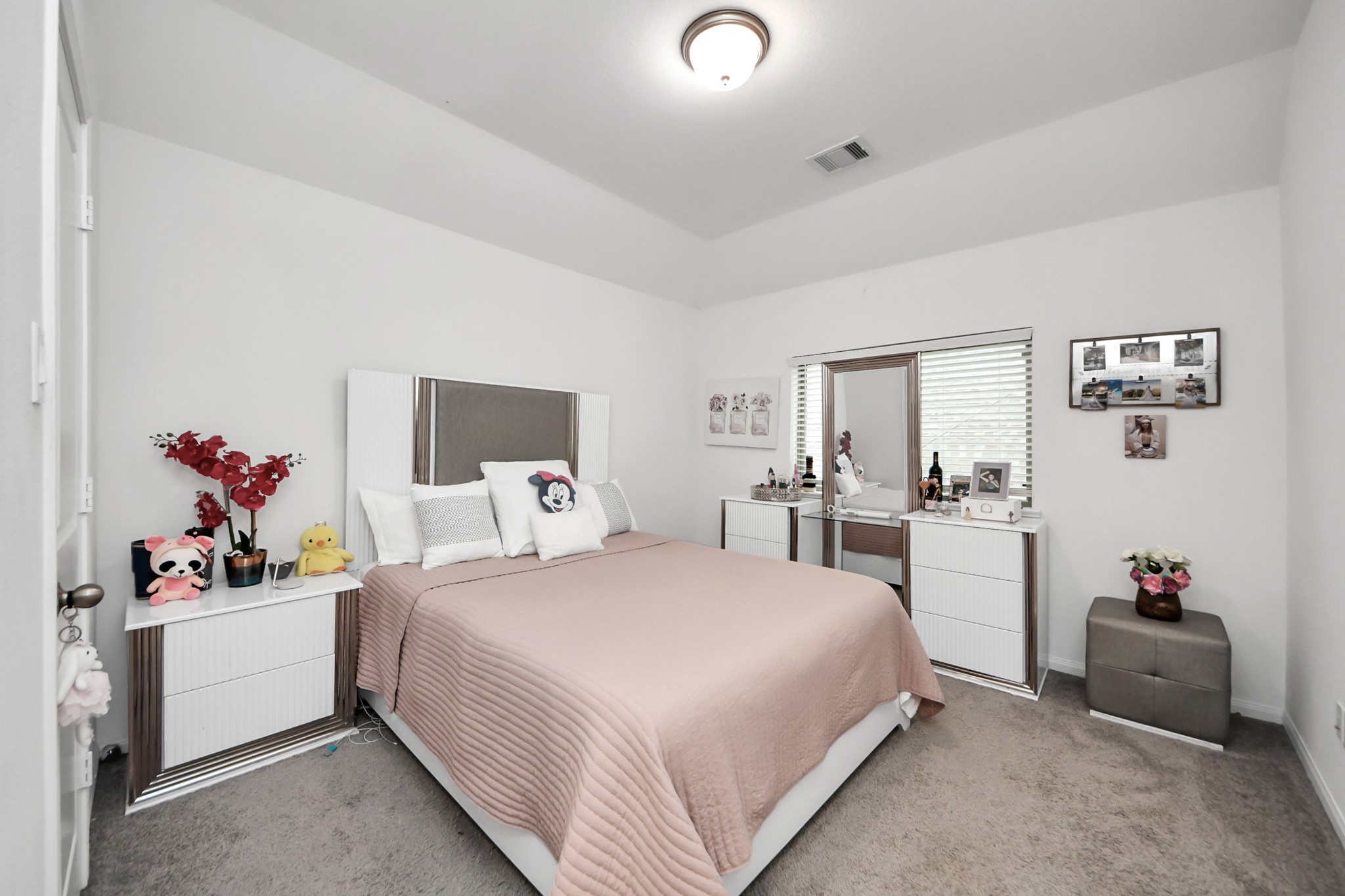 14948 Galileo Gates Drive Conroe, TX 77302 - Photo 21 of 30 a bedroom with a bed and a couch