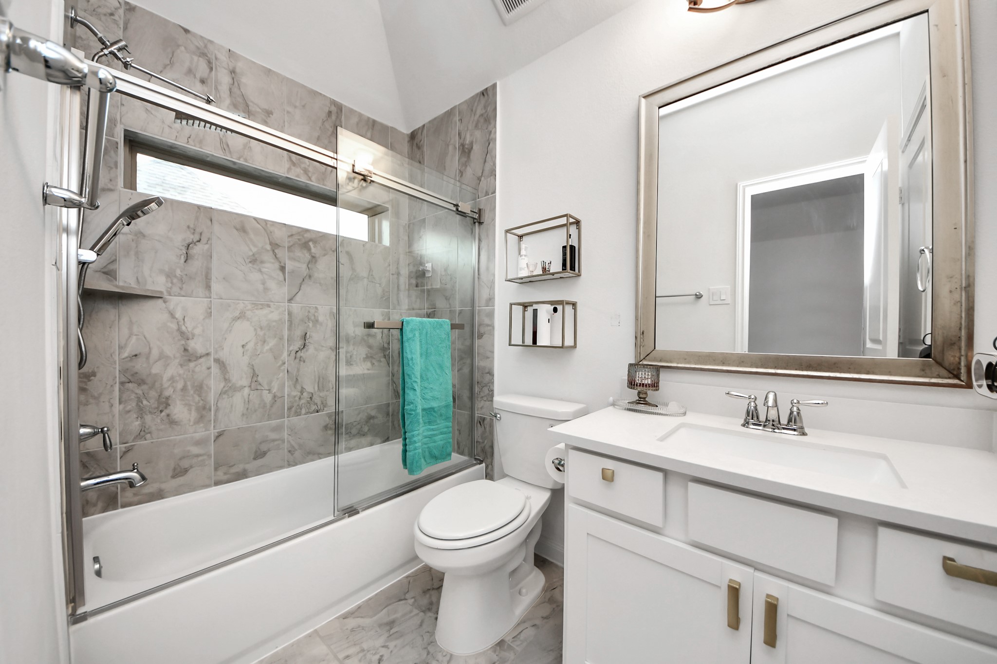 14948 Galileo Gates Drive Conroe, TX 77302 - Photo 22 of 30 a bathroom with a sink toilet and shower