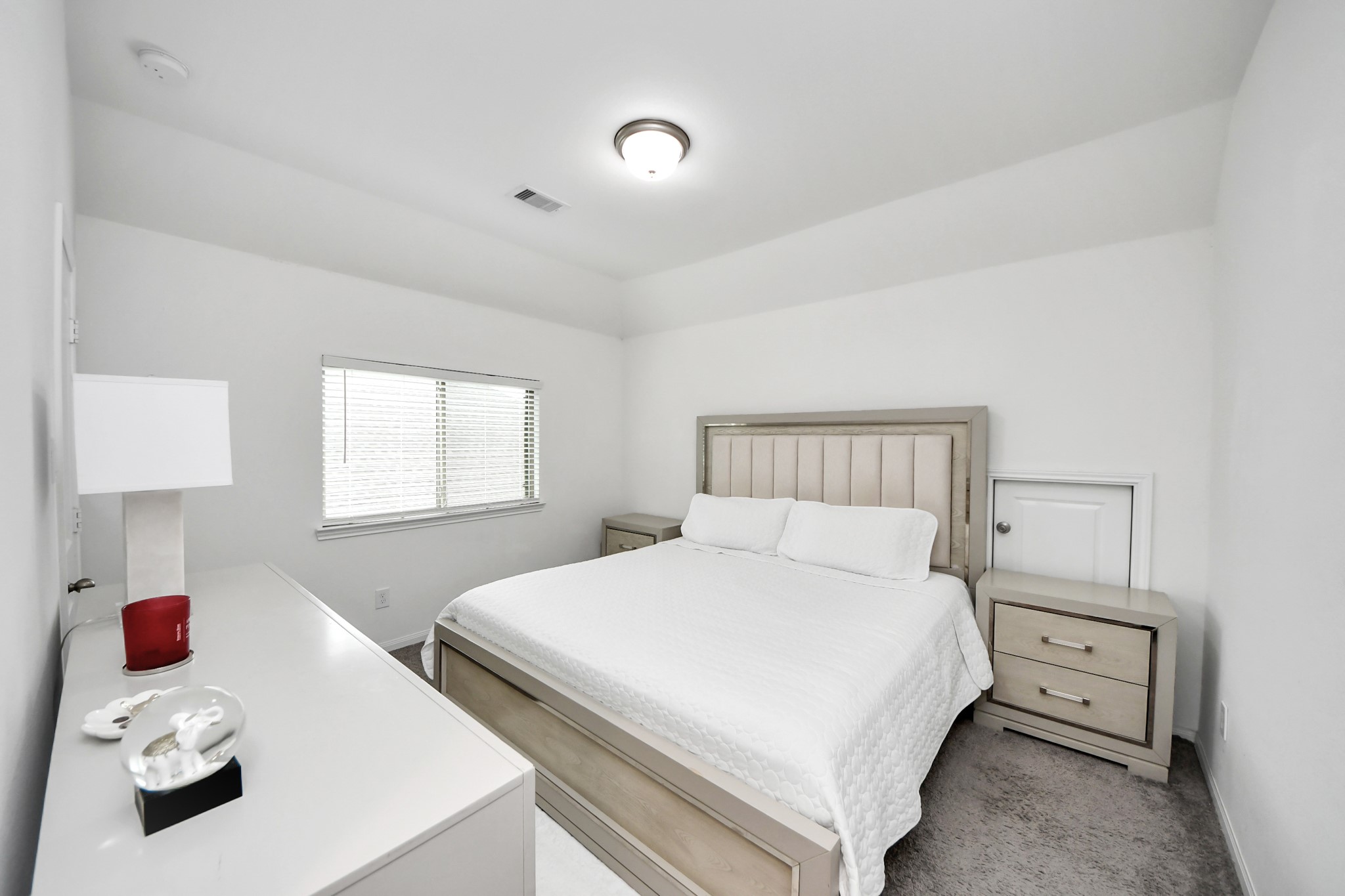 14948 Galileo Gates Drive Conroe, TX 77302 - Photo 23 of 30 a bedroom with a bed and a window