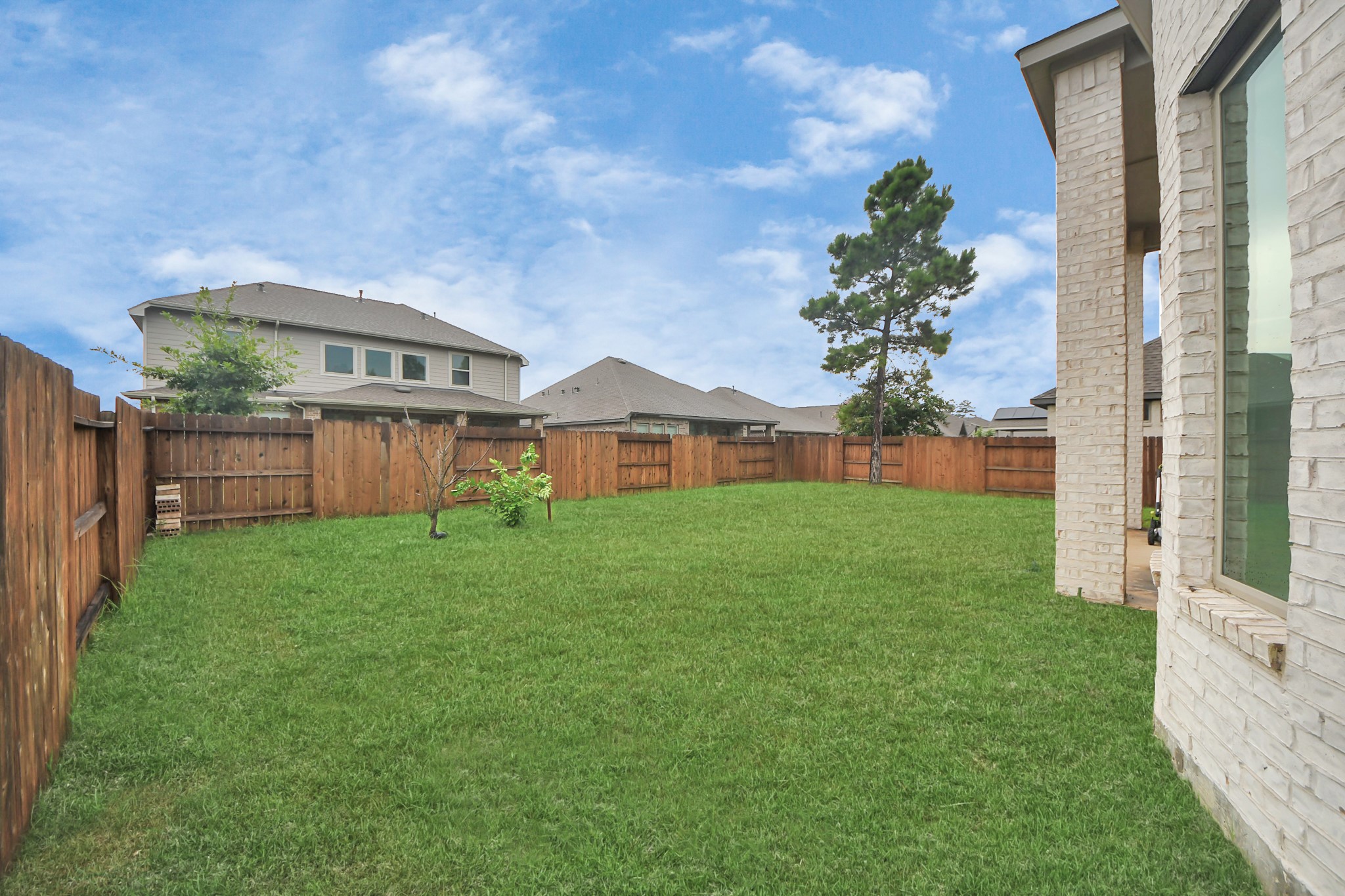 14948 Galileo Gates Drive Conroe, TX 77302 - Photo 28 of 30 a view of a house with backyard and garden