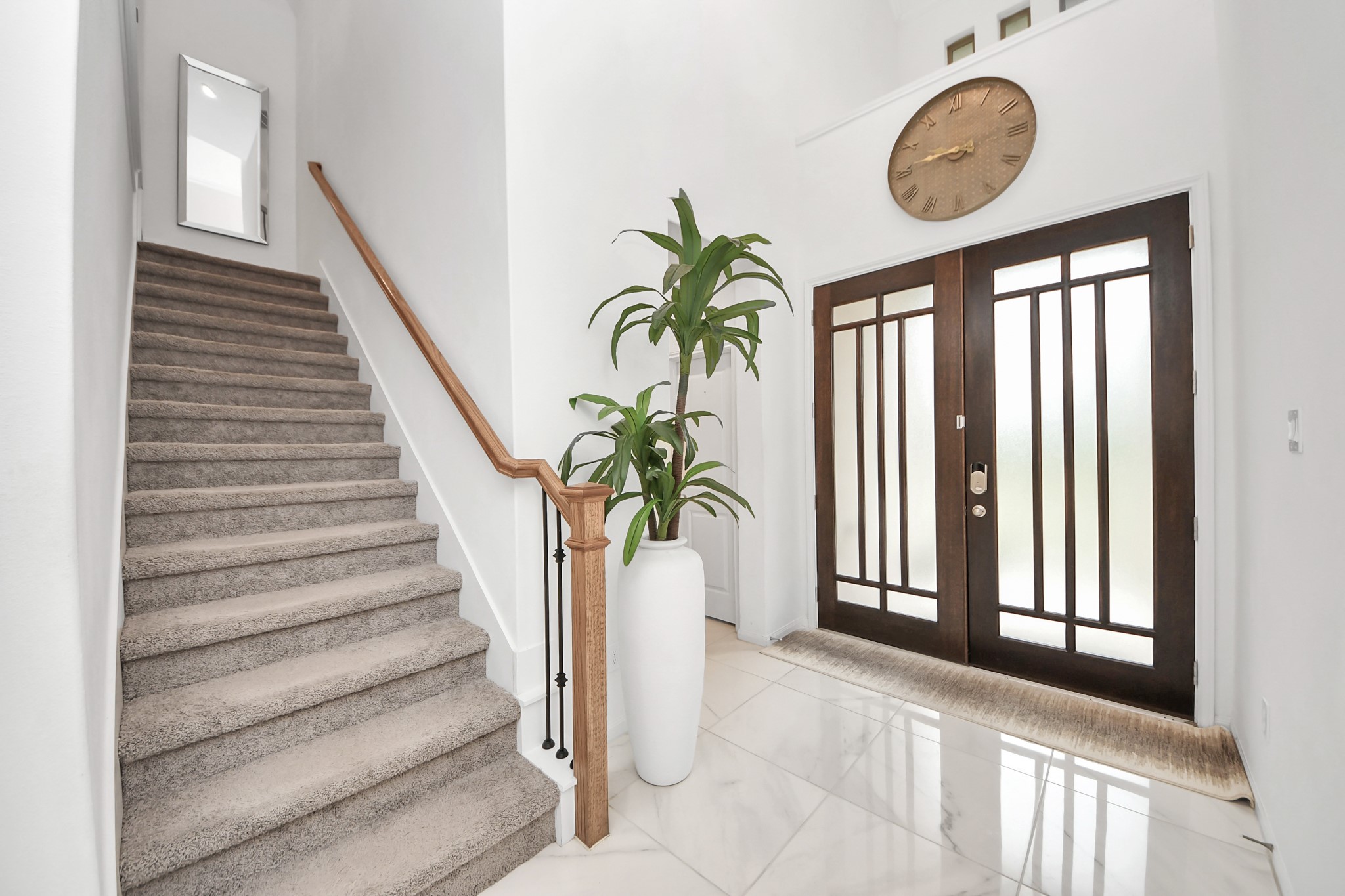 14948 Galileo Gates Drive Conroe, TX 77302 - Photo 4 of 30 a view of staircase with a large window and a potted plant