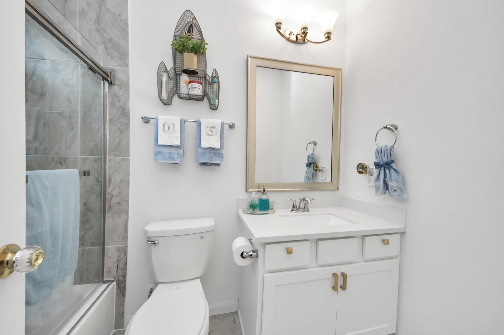 14948 Galileo Gates Drive Conroe, TX 77302 - Photo 6 of 30 a bathroom with a toilet sink and mirror