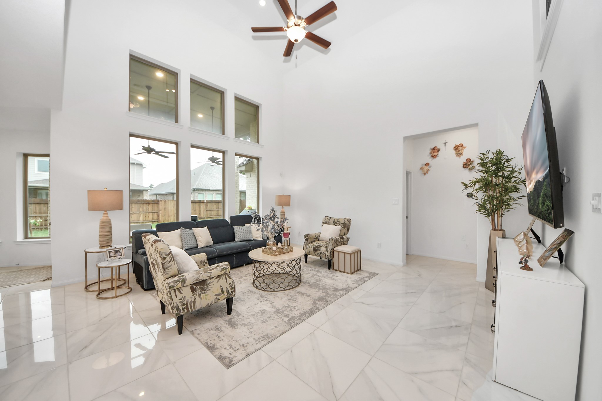 14948 Galileo Gates Drive Conroe, TX 77302 - Photo 9 of 30 a living room with furniture and a flat screen tv