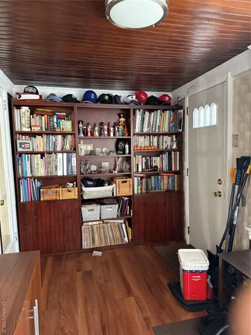 a room with furniture and wooden floor