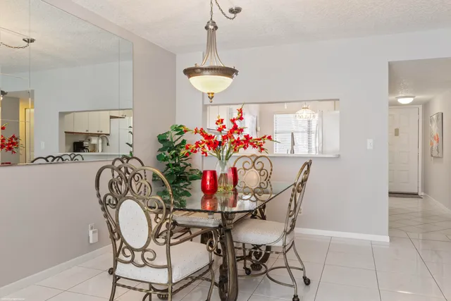 a kitchen with a sink appliances and cabinets