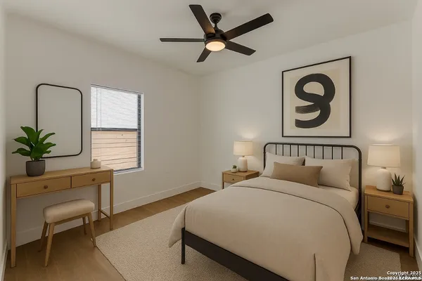 a bedroom with a bed and a chair