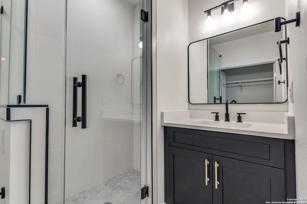 a bathroom with a sink and a mirror