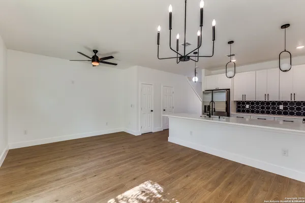 a view of a kitchen with a sink and cabinets