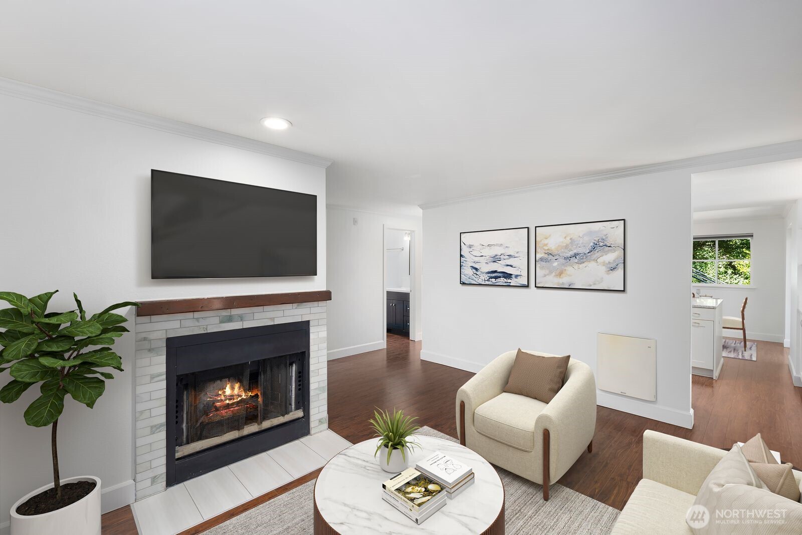 3901 Fremont Avenue North, Unit 202 Seattle, WA 98103 - Photo 1 of 23 a living room with furniture a fireplace and a flat screen tv