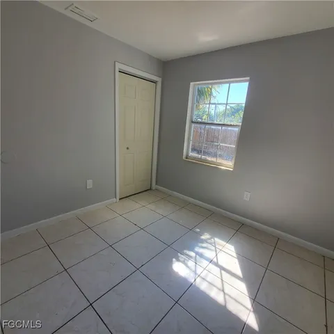 a view of an empty room and window