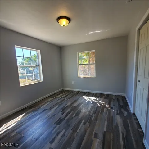 a view of an empty room and a window