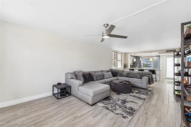 a living room with furniture or couch and a bookshelf