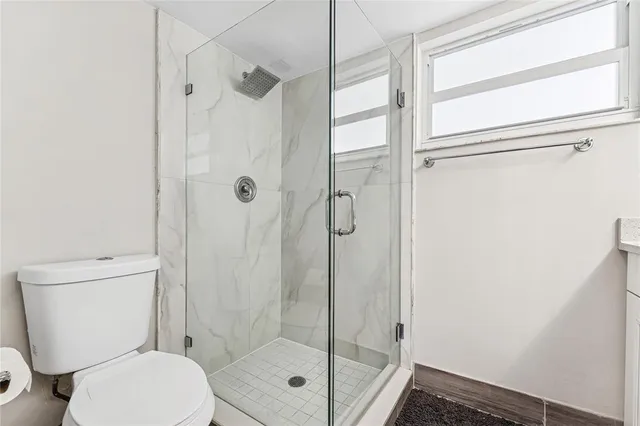 a spacious bedroom with a bed and a dresser