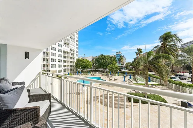 a view of a swimming pool with a patio