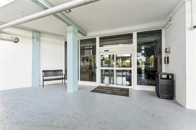 an empty room with furniture and windows