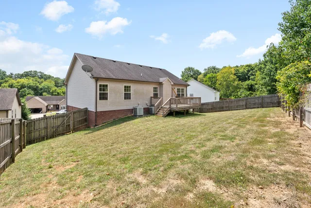 a house view with wooden fencing