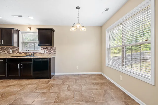 a view of a kitchen with a stove cabinets and a wooden floor