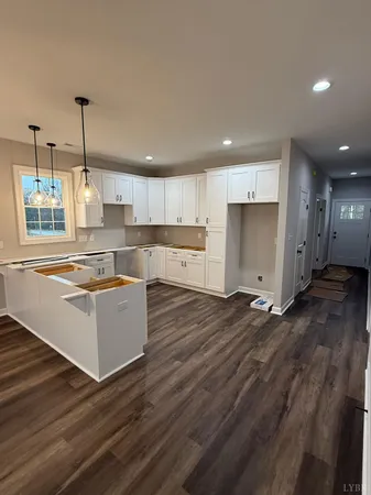 a front view of a house with a flat screen tv and a yard