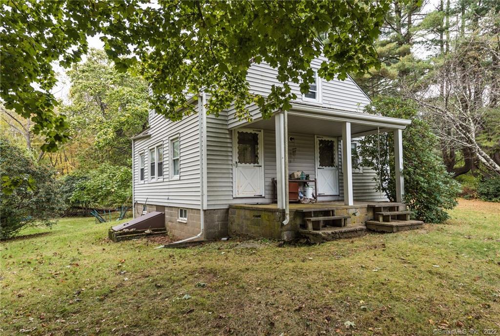 300 Shelton Road Monroe, CT 06468 - Photo 1 of 1 a view of a chair and table in the backyard