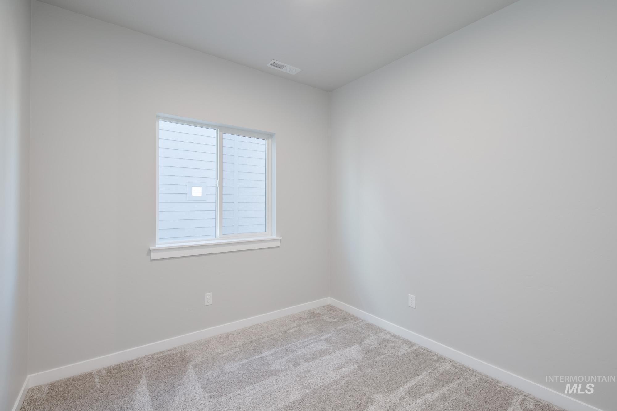 2058 South Border Way Meridian, ID 83642 - Photo 13 of 25 Carpeted spare room with baseboards