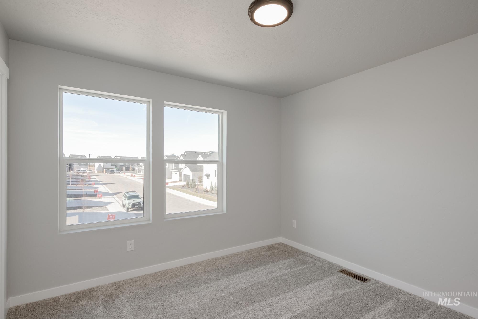 2058 South Border Way Meridian, ID 83642 - Photo 22 of 25 Carpeted empty room with baseboards