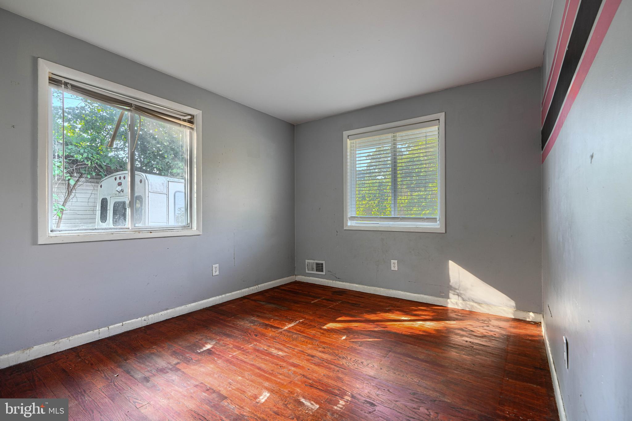 9706 Liberty Road Randallstown, MD 21133 - Photo 28 of 43 a view of a room with wooden floor and window