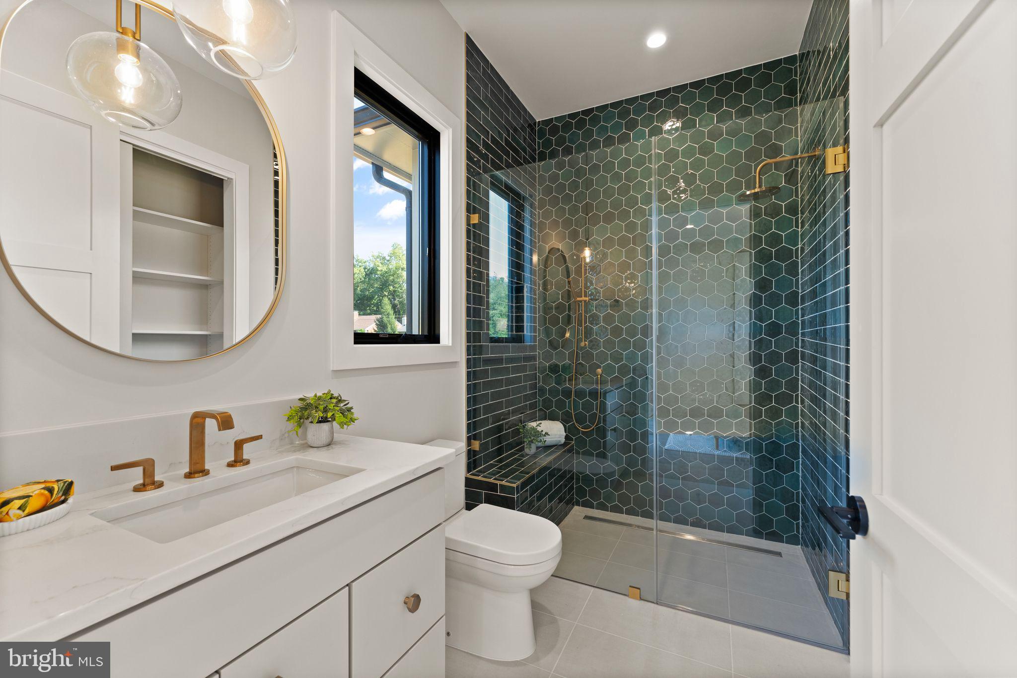 917 Timber Lane Southwest Vienna, VA 22180 - Photo 16 of 41 a bathroom with a granite countertop sink a toilet a mirror a vanity and shower