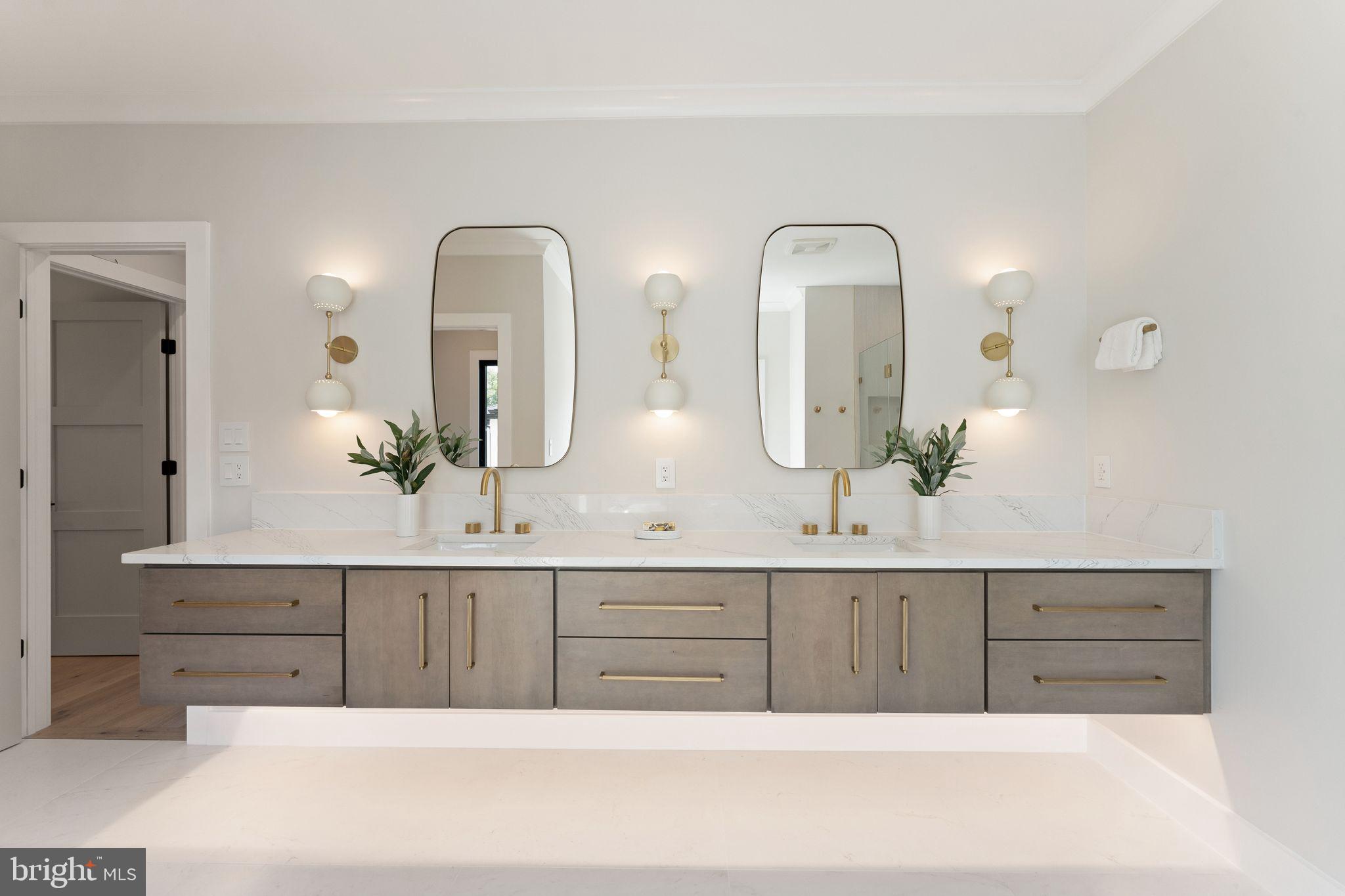 917 Timber Lane Southwest Vienna, VA 22180 - Photo 25 of 41 a bathroom with double vanity sinks and a two mirror