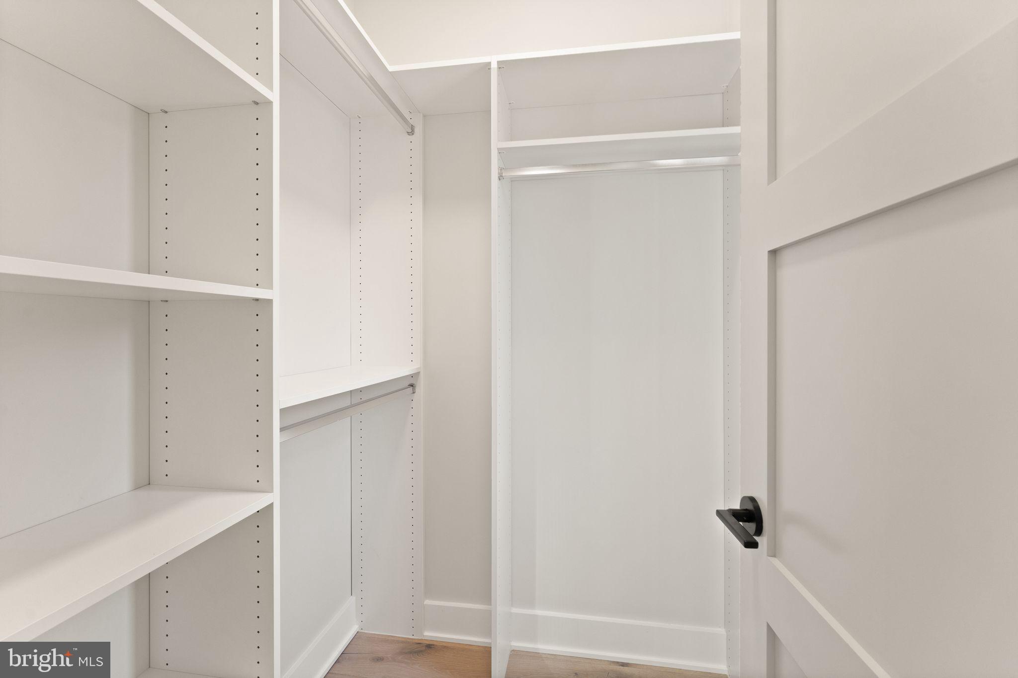 917 Timber Lane Southwest Vienna, VA 22180 - Photo 33 of 41 a view of walk in closet with empty racks