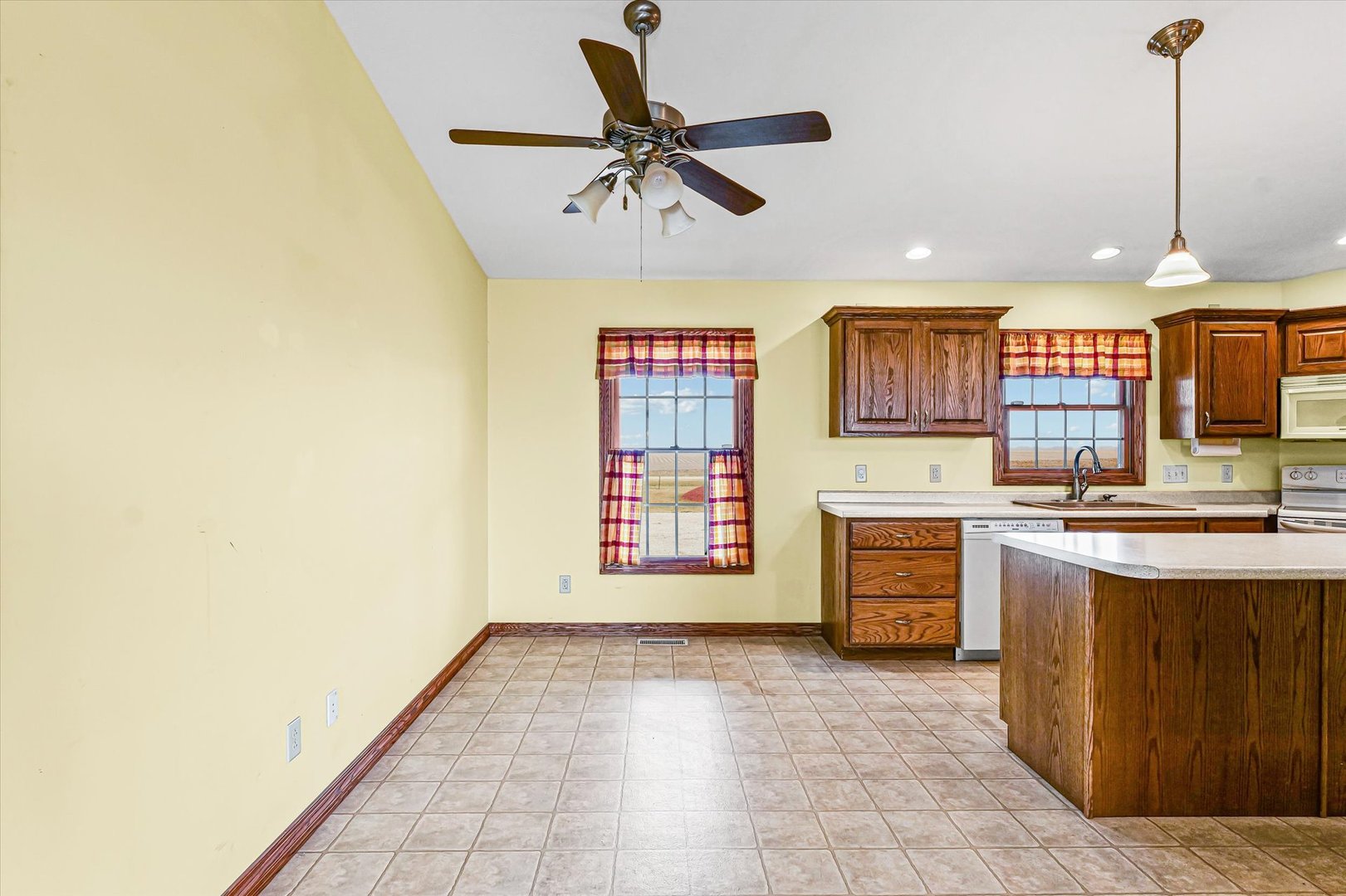 8735 North 2000 E Road Fairbury, IL 61739 - Photo 13 of 64 a open kitchen with a sink stove and a refrigerator