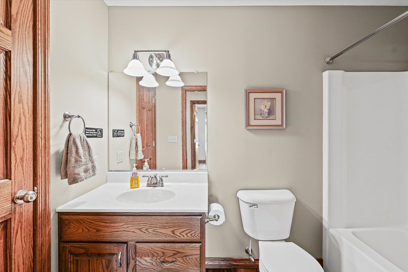 8735 North 2000 E Road Fairbury, IL 61739 - Photo 23 of 64 a bathroom with a toilet sink and mirror