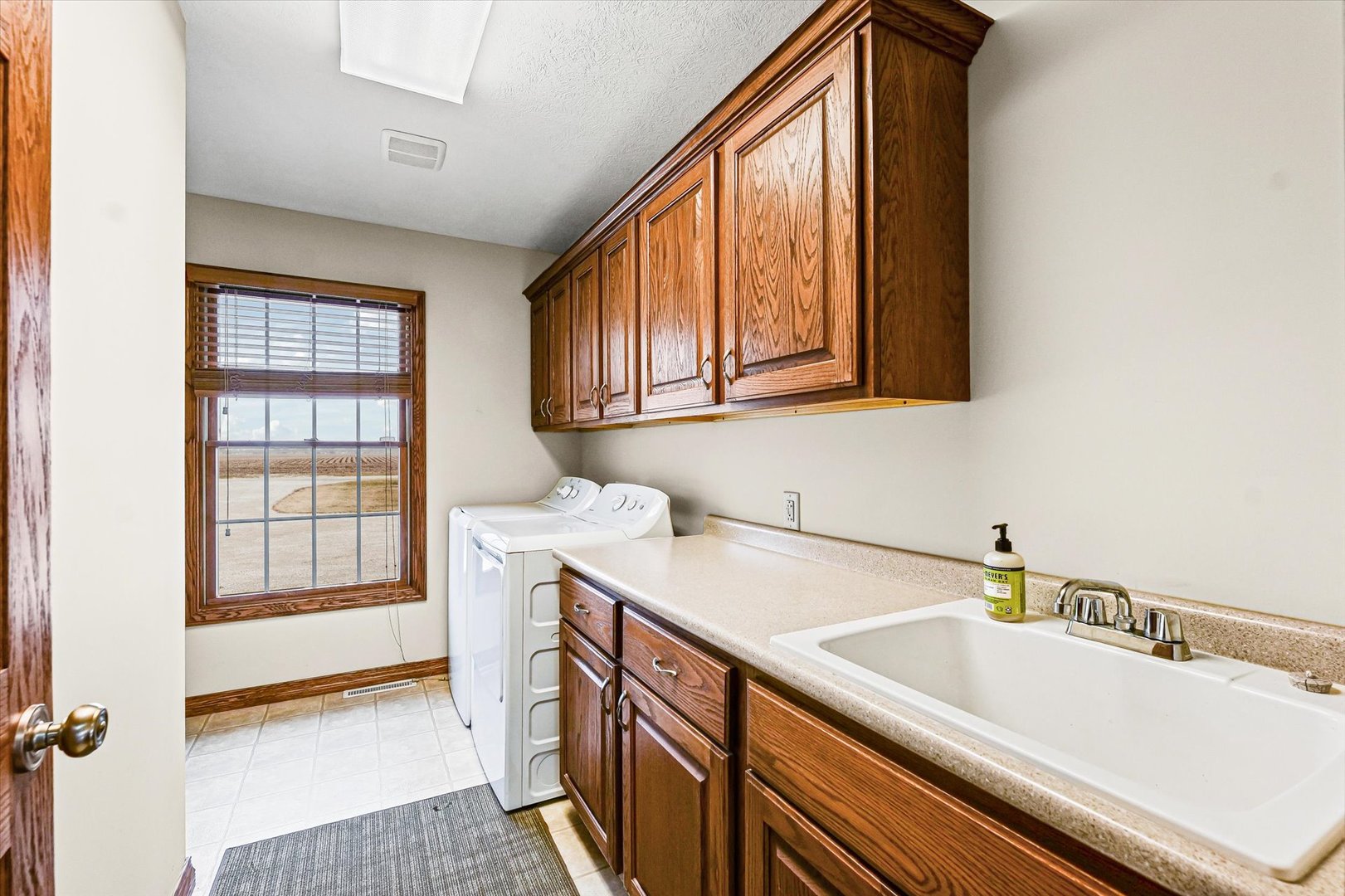 8735 North 2000 E Road Fairbury, IL 61739 - Photo 24 of 64 a kitchen with a sink cabinets and a window