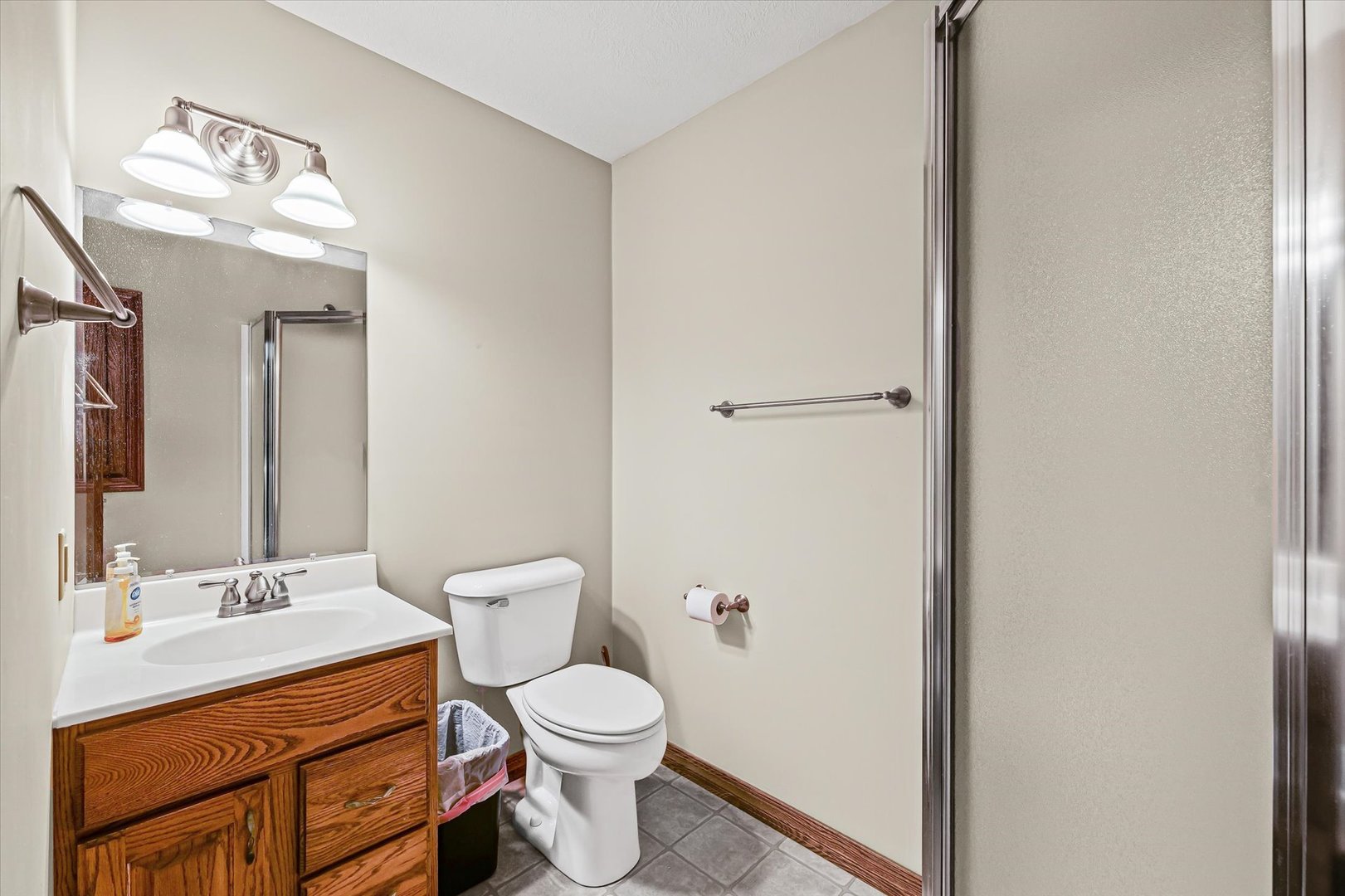 8735 North 2000 E Road Fairbury, IL 61739 - Photo 25 of 64 a bathroom with a toilet sink and mirror