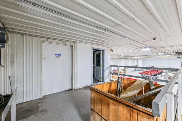 a view of parking garage with cars