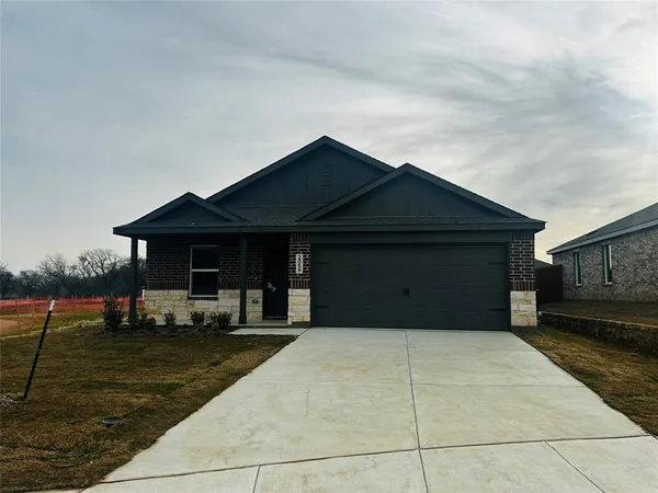 a front view of building with yard