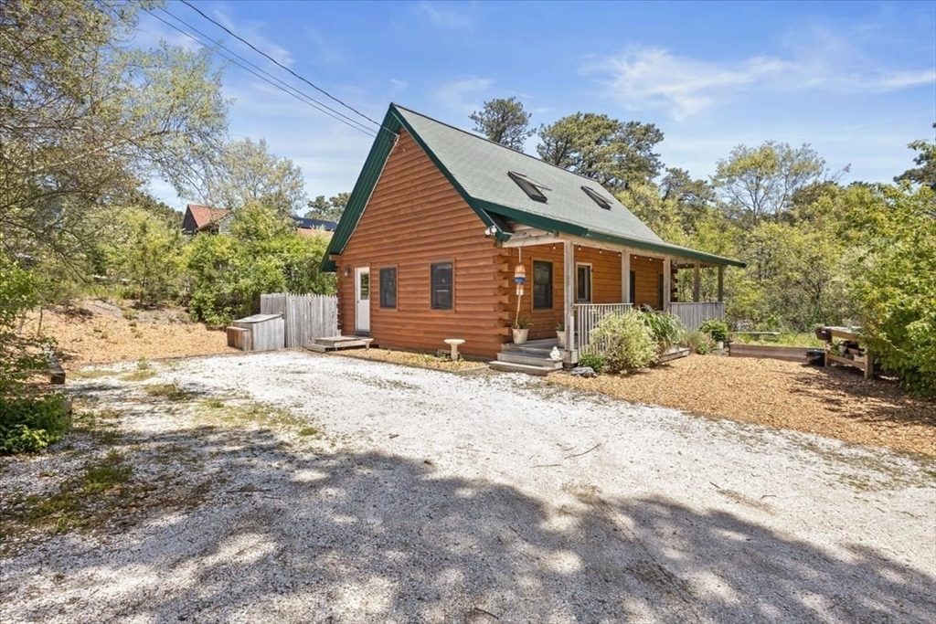35 Tecumseh Road Wellfleet, MA 02667 - Photo 16 of 24 a view of a house with a yard