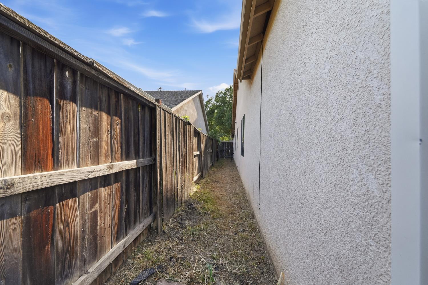 2220 Ellison Drive Modesto, CA 95355 - Photo 44 of 53 a view of a pathway of a house with wooden floor