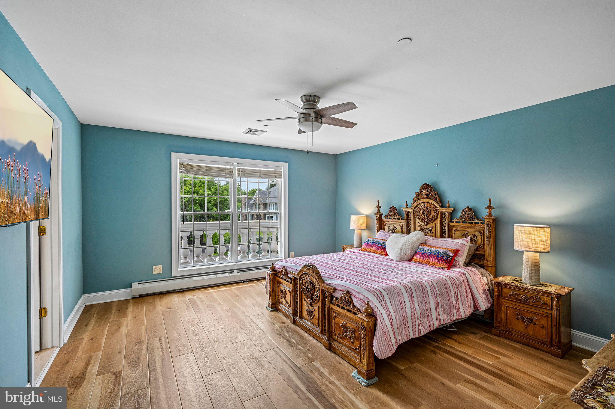 434 Meetinghouse Road Ambler, PA 19002 - Photo 37 of 51 a bedroom with a bed and a large window with wooden floor
