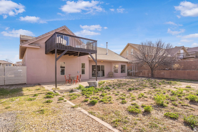 1570 South Rio Virgin Drive Washington, UT 84780 - Photo 70 of 71 Back of property with a fenced backyard, a patio area, and stucco siding
