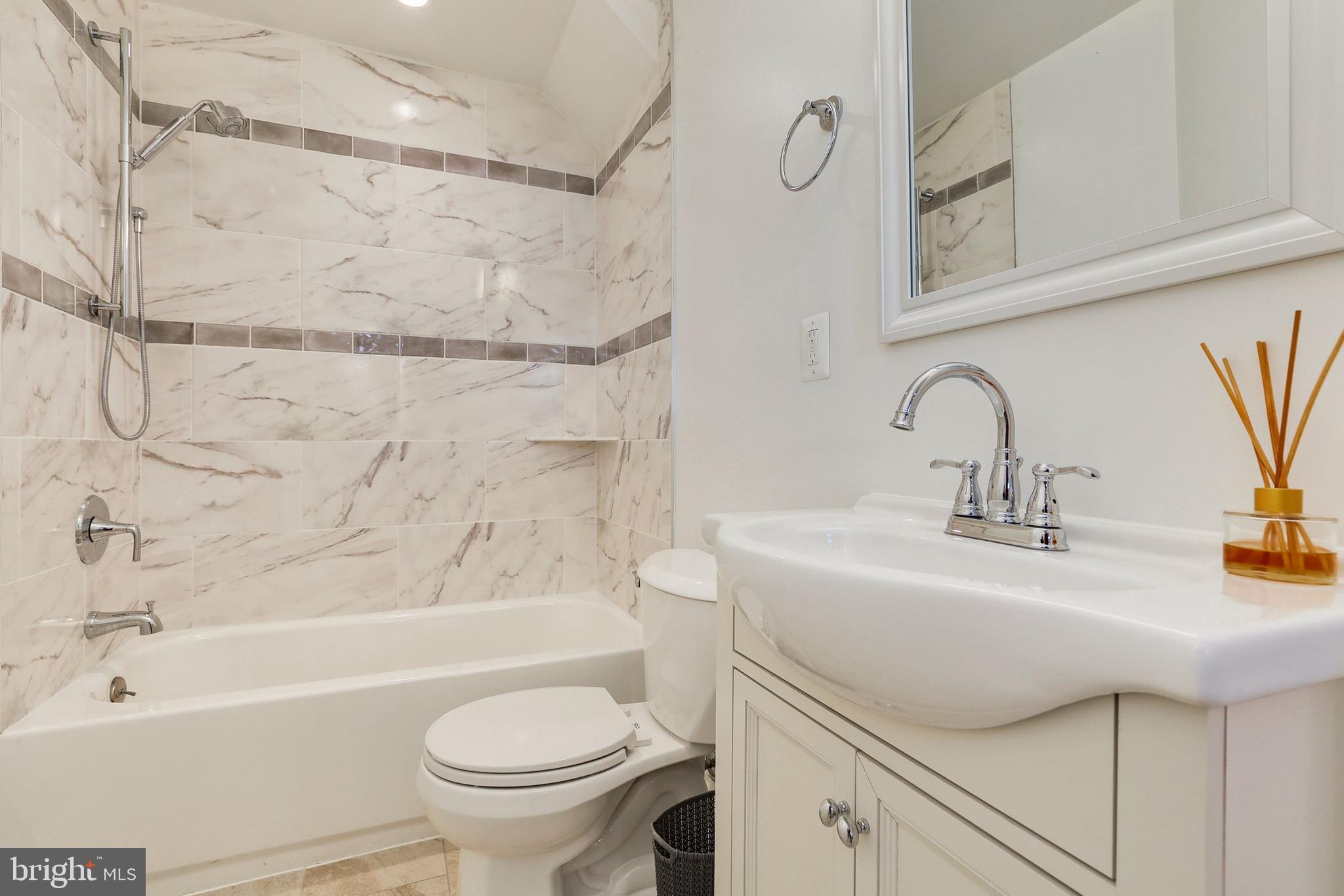 5629 8th Street Northwest Washington, DC 20011 - Photo 33 of 42 a bathroom with a sink a toilet and a bathtub