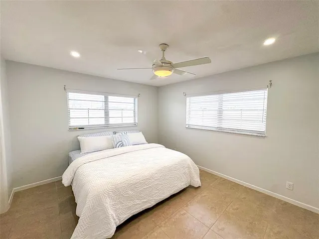 a view of a patio with swimming pool table and chairs