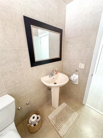 a view of hallway with wooden floor