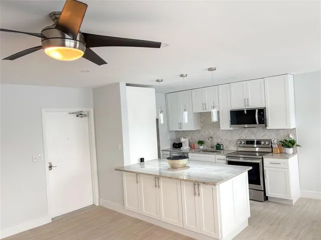 a view of a balcony with furniture