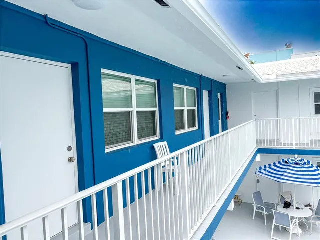 a view of a kitchen with swimming pool and sitting area