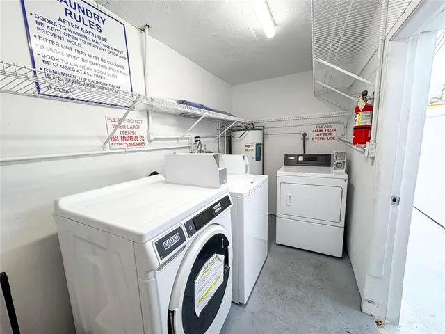 a kitchen with a sink and a refrigerator