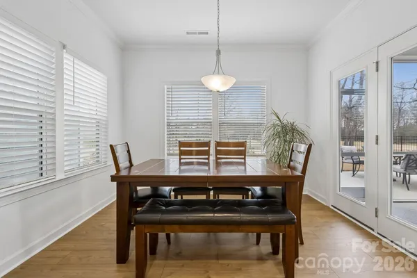 a view of a dining room with furniture and window