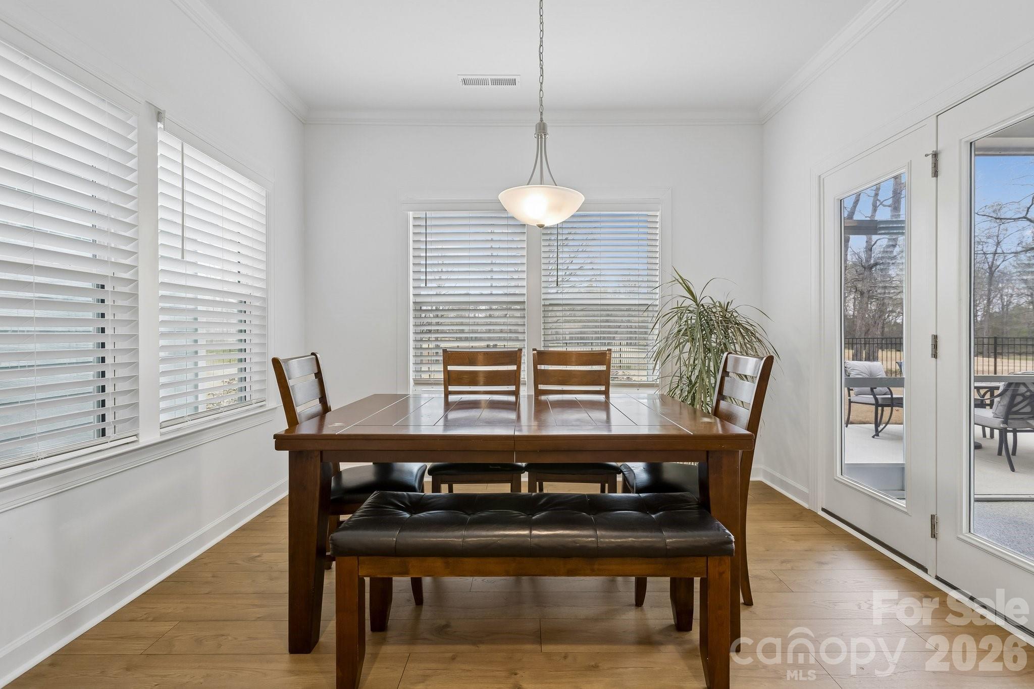 911 Cypress Point Lane Monroe, NC 28112 - Photo 11 of 37 a view of a dining room with furniture and window