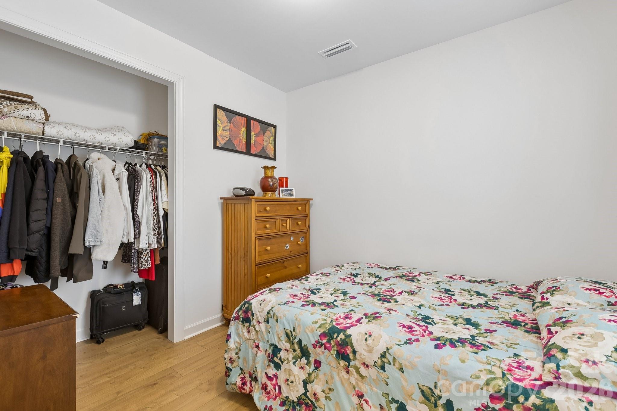 911 Cypress Point Lane Monroe, NC 28112 - Photo 15 of 37 a bedroom with a bed and a closet