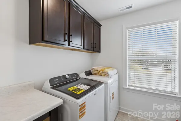 a view of storage and utility room with washer and dryer